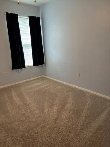 an empty room with wooden floor