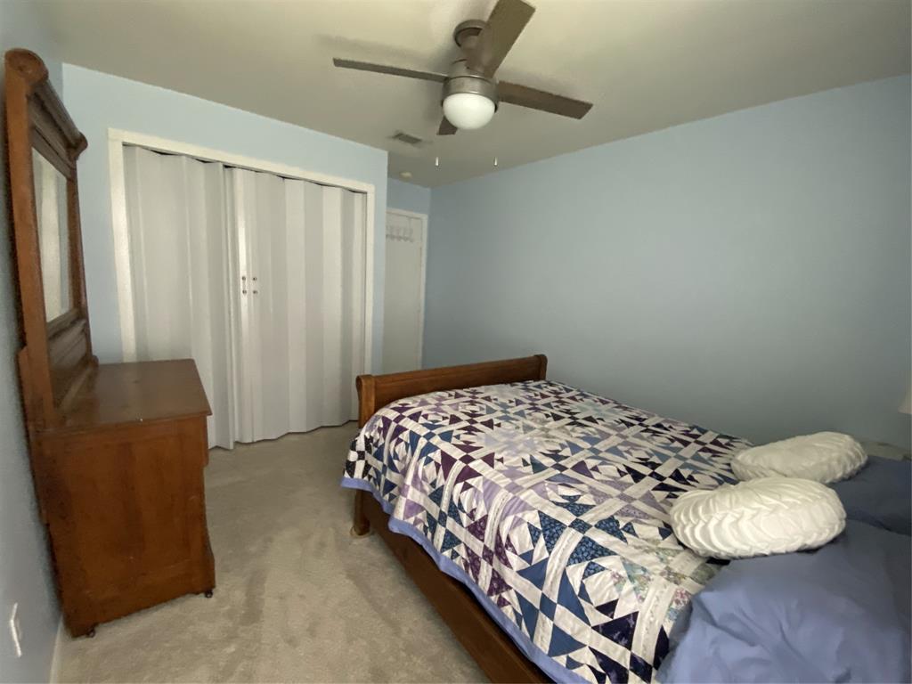 1500 Lake Shore Drive, Unit 213 Waco, TX 76708 - Photo 6 of 21 a bedroom with a bed and a window