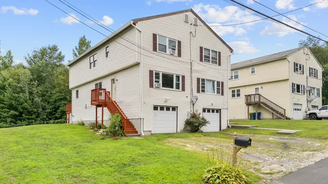 a view of a house with a yard