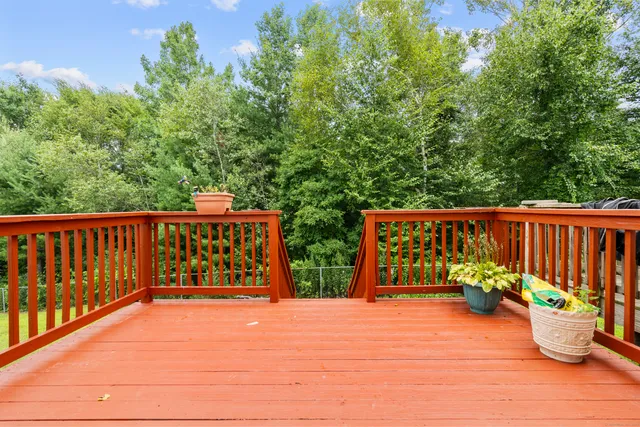 a balcony with table and chairs