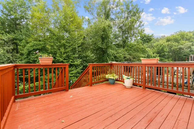a view of deck with wooden floor and fence