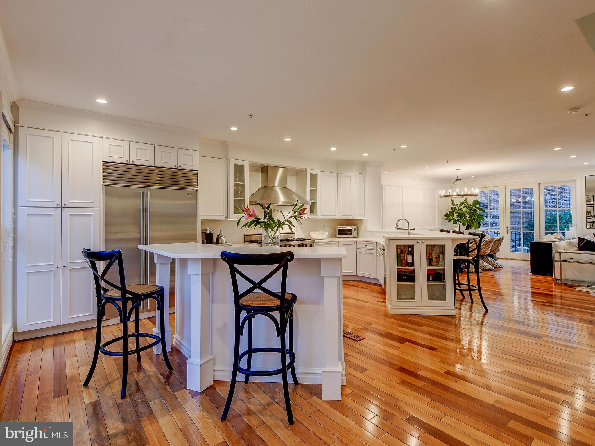 1230 Dockside Circle Baltimore, MD 21224 - Photo 15 of 70 a view of a dining room with furniture and wooden floor