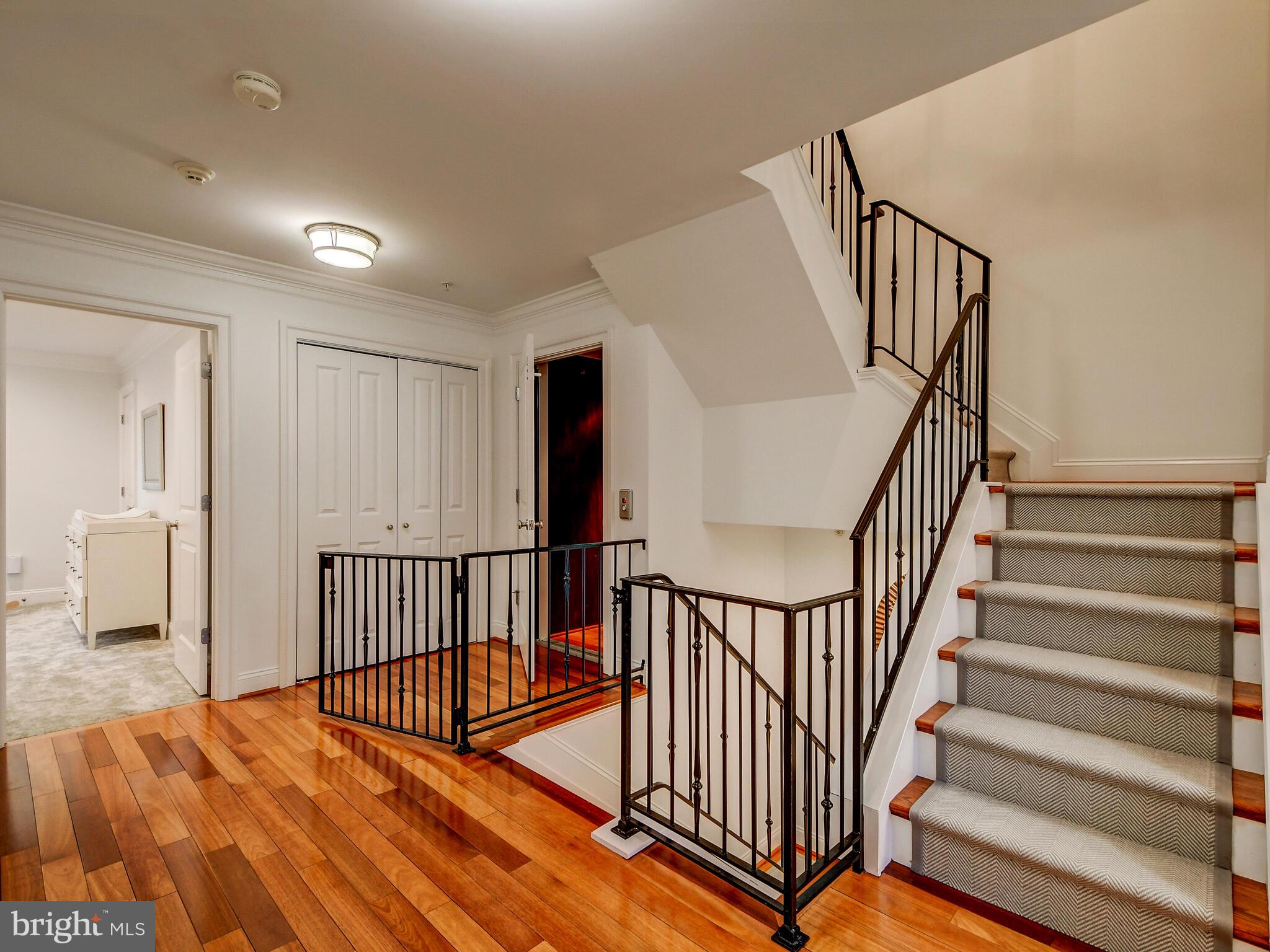 1230 Dockside Circle Baltimore, MD 21224 - Photo 22 of 70 a view of staircase with wooden floor and a rug