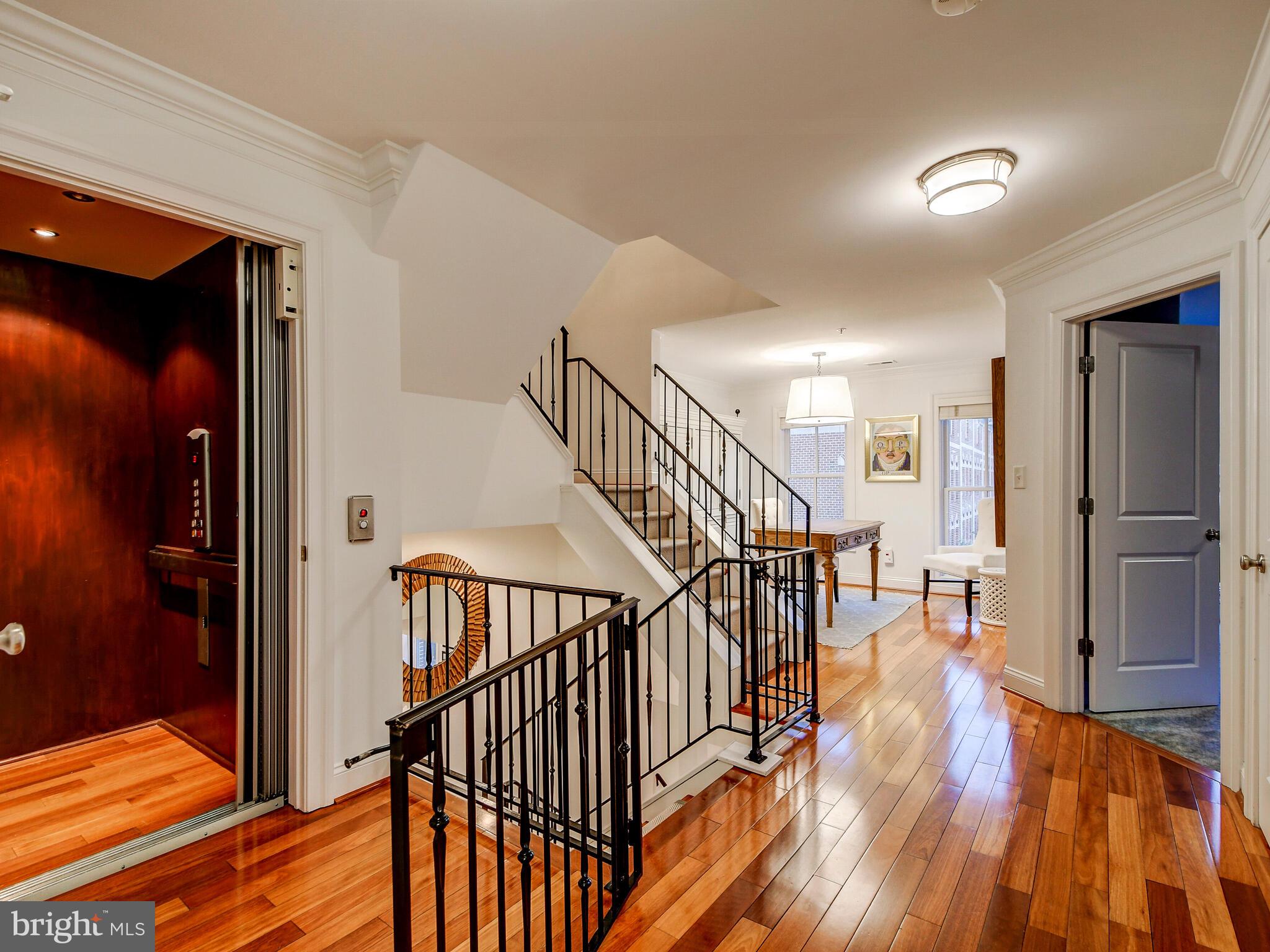 1230 Dockside Circle Baltimore, MD 21224 - Photo 23 of 70 a view of hallway with wooden floor and stairs