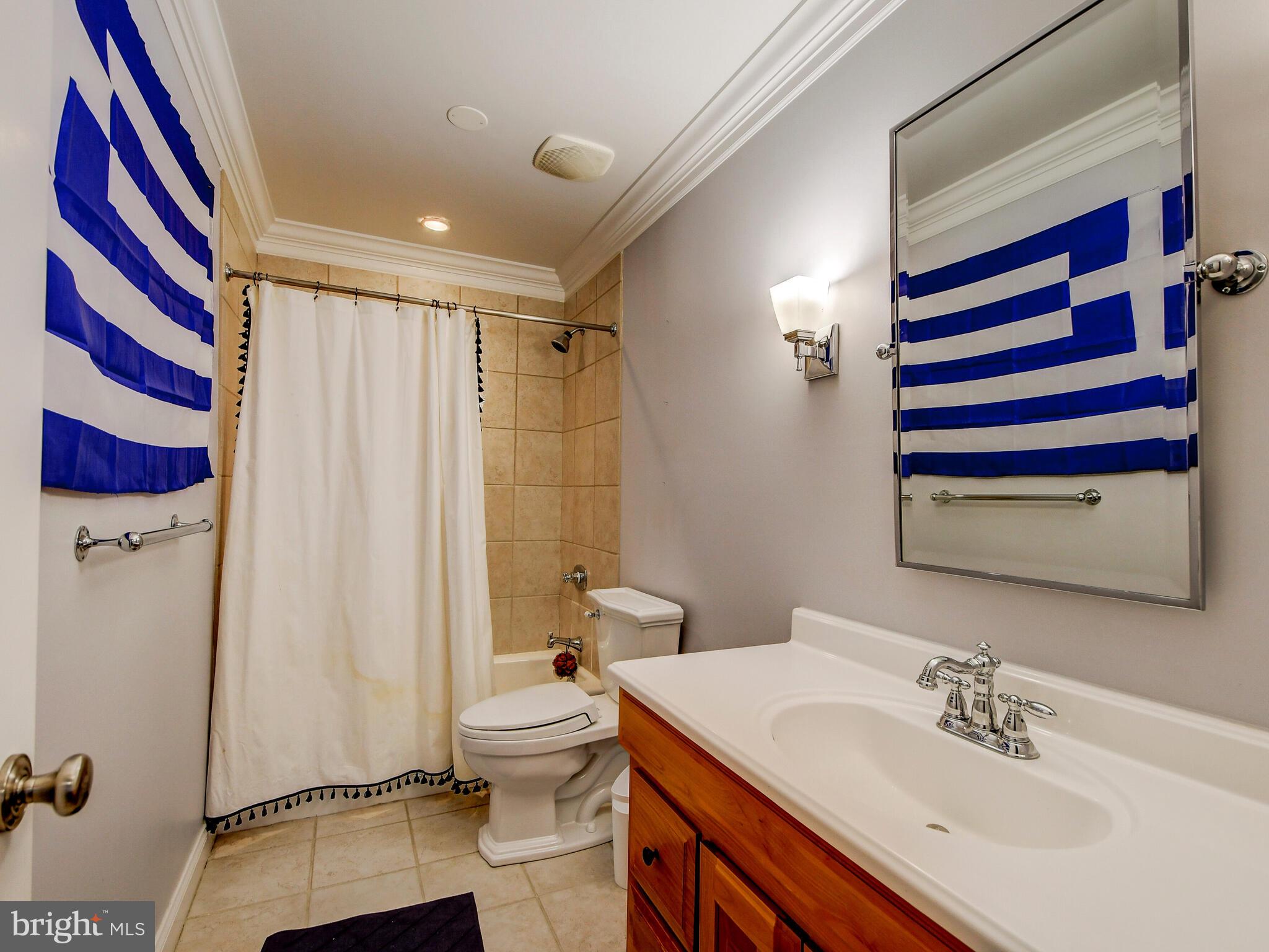 1230 Dockside Circle Baltimore, MD 21224 - Photo 29 of 70 a bathroom with a sink and a mirror