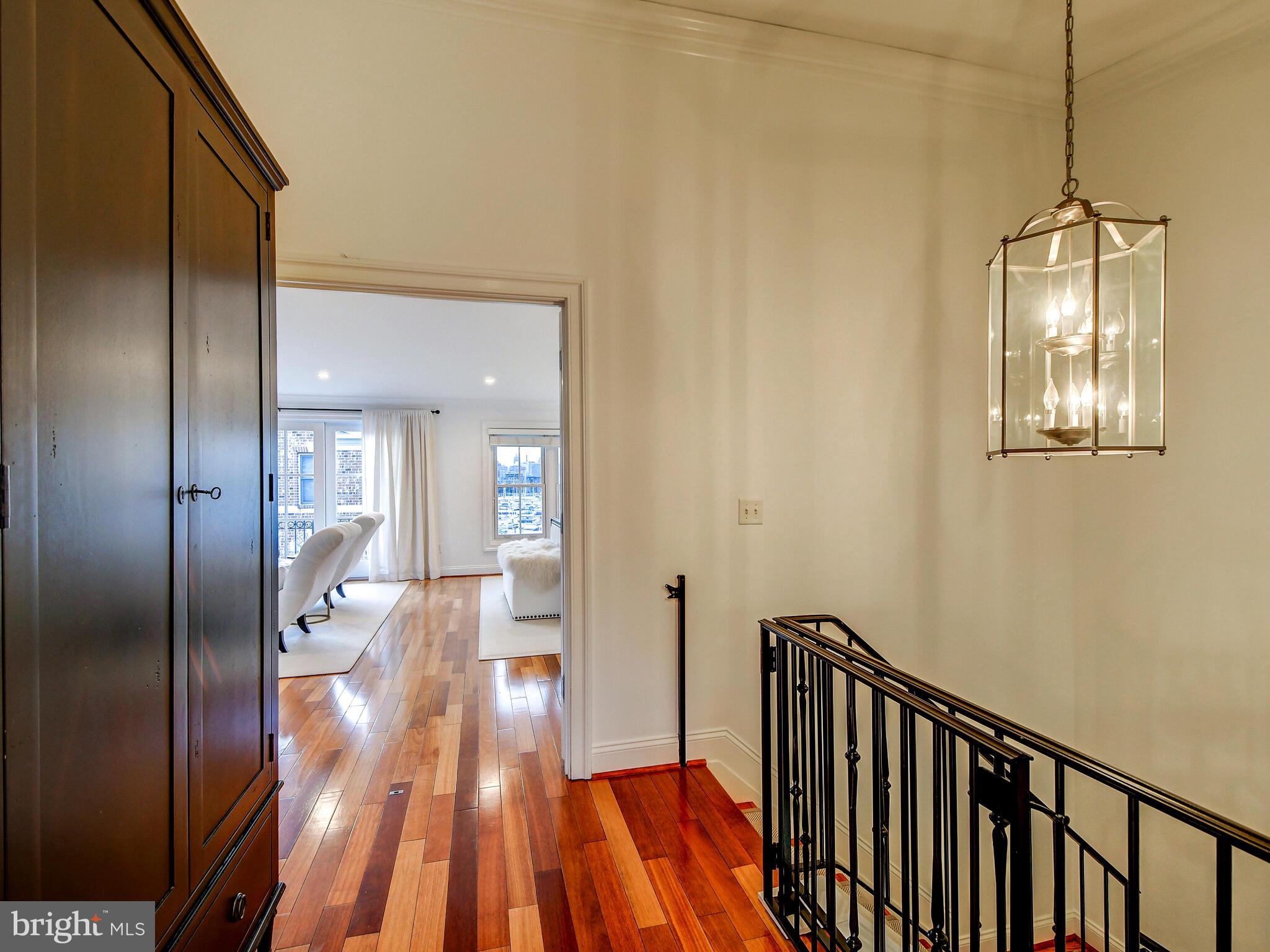 1230 Dockside Circle Baltimore, MD 21224 - Photo 30 of 70 a view of hallway with wooden floor