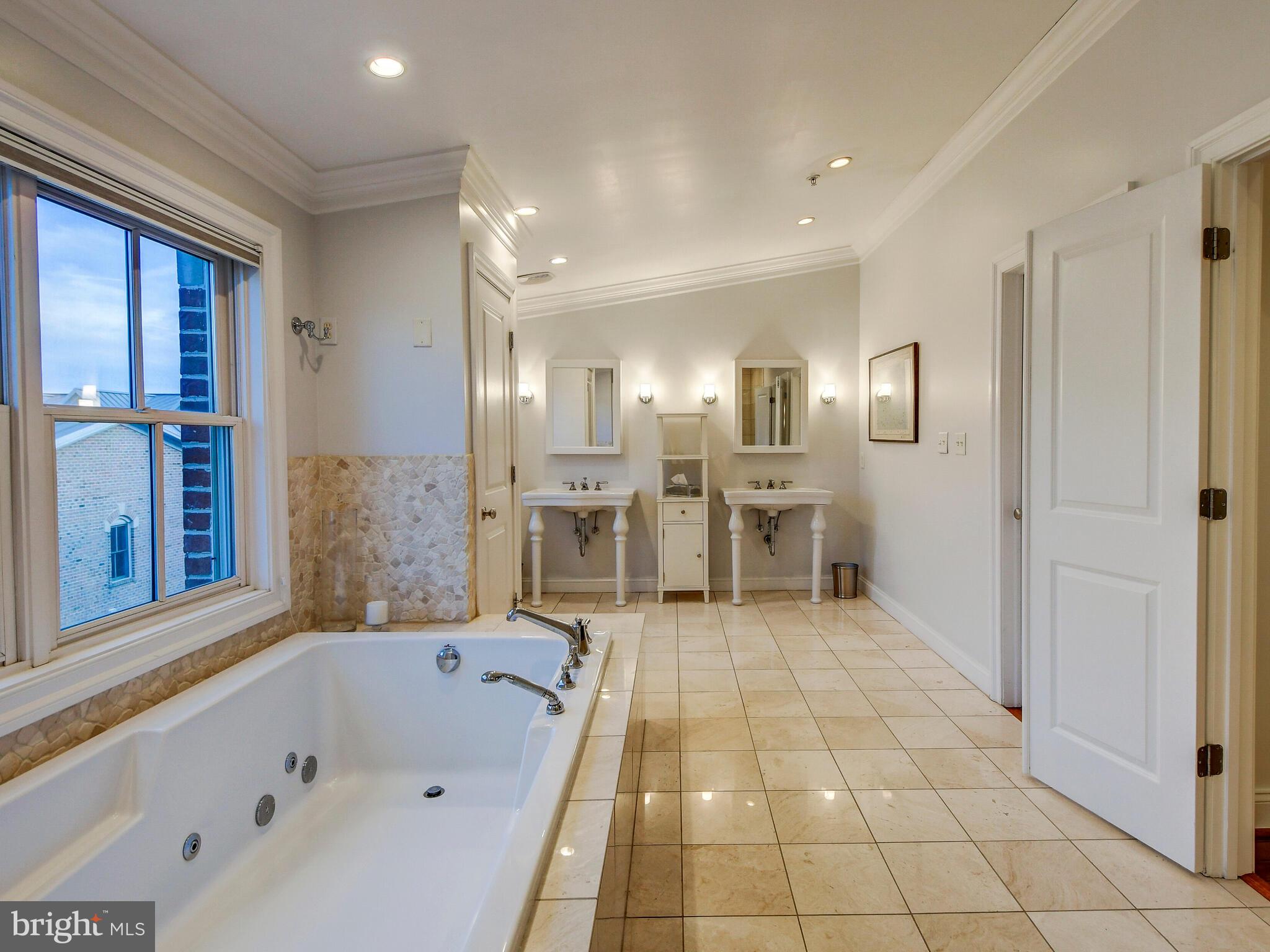 1230 Dockside Circle Baltimore, MD 21224 - Photo 36 of 70 a bathroom with a bathtub and a shower