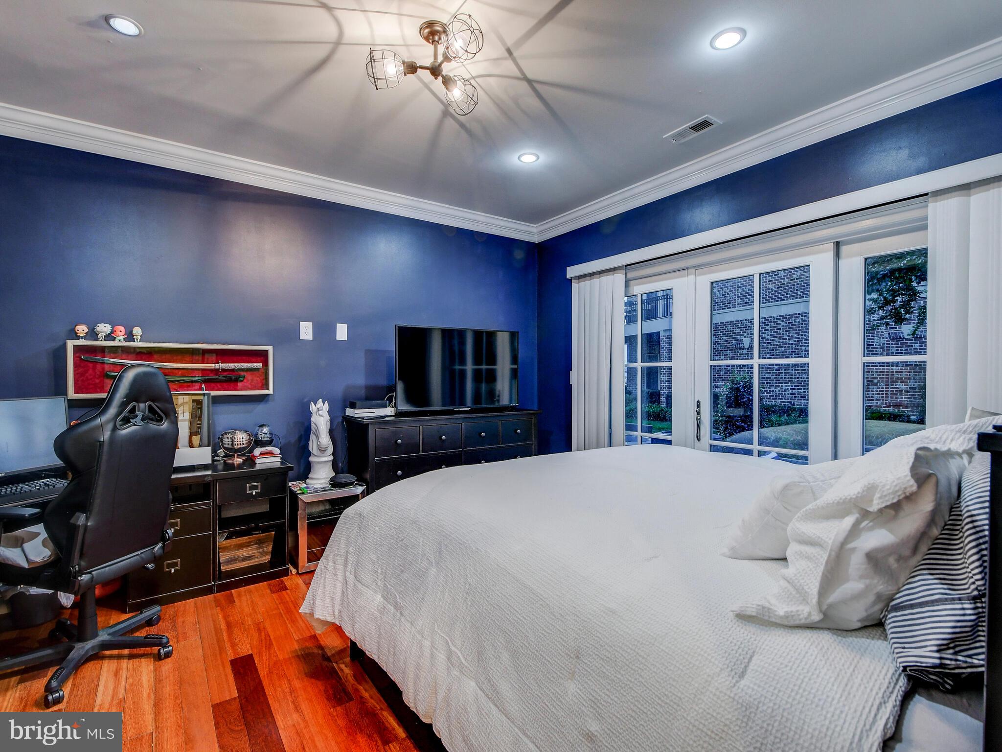 1230 Dockside Circle Baltimore, MD 21224 - Photo 43 of 70 a bed room with a bed and a television