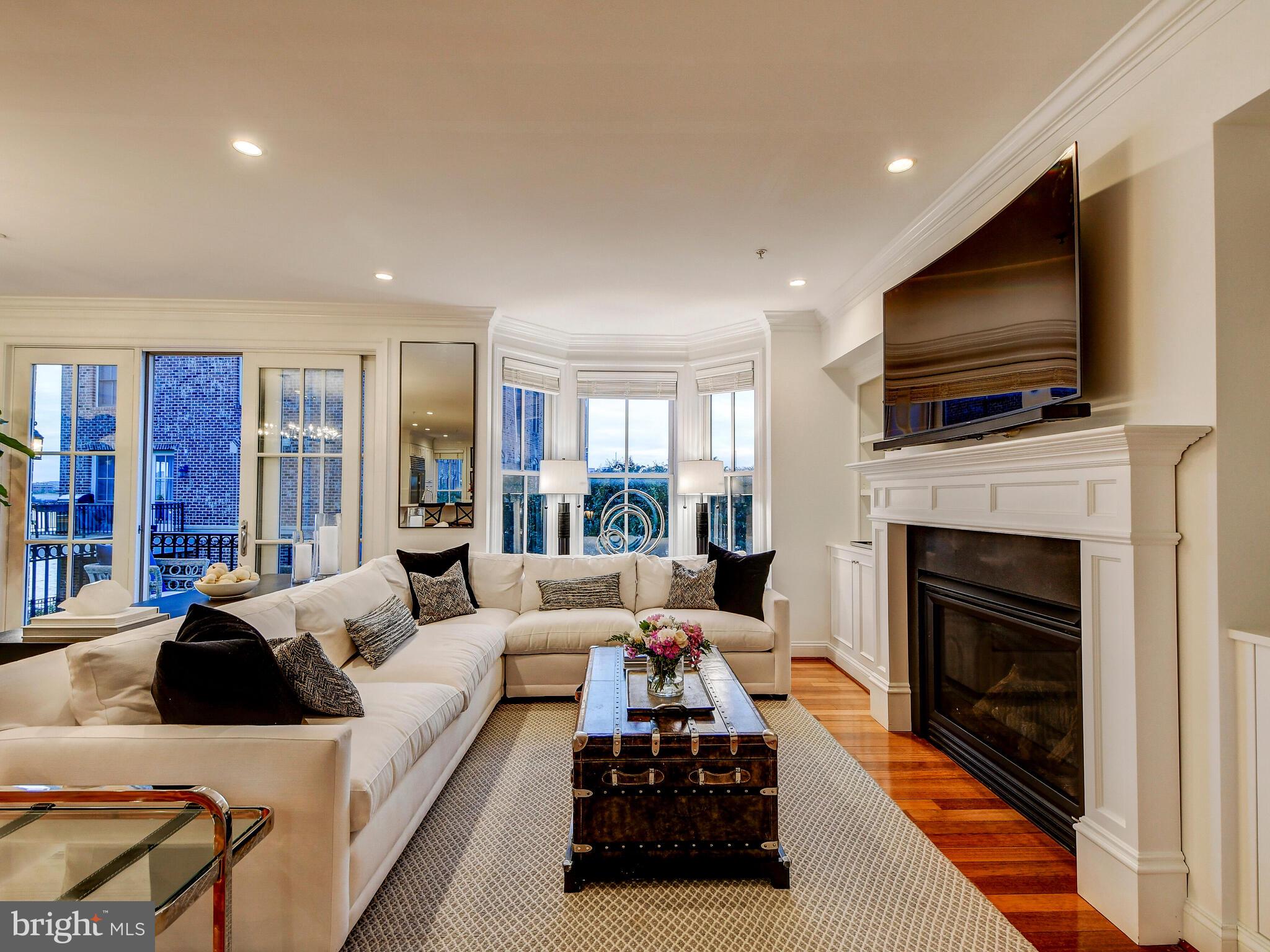 1230 Dockside Circle Baltimore, MD 21224 - Photo 8 of 70 a living room with furniture a flat screen tv and a fireplace