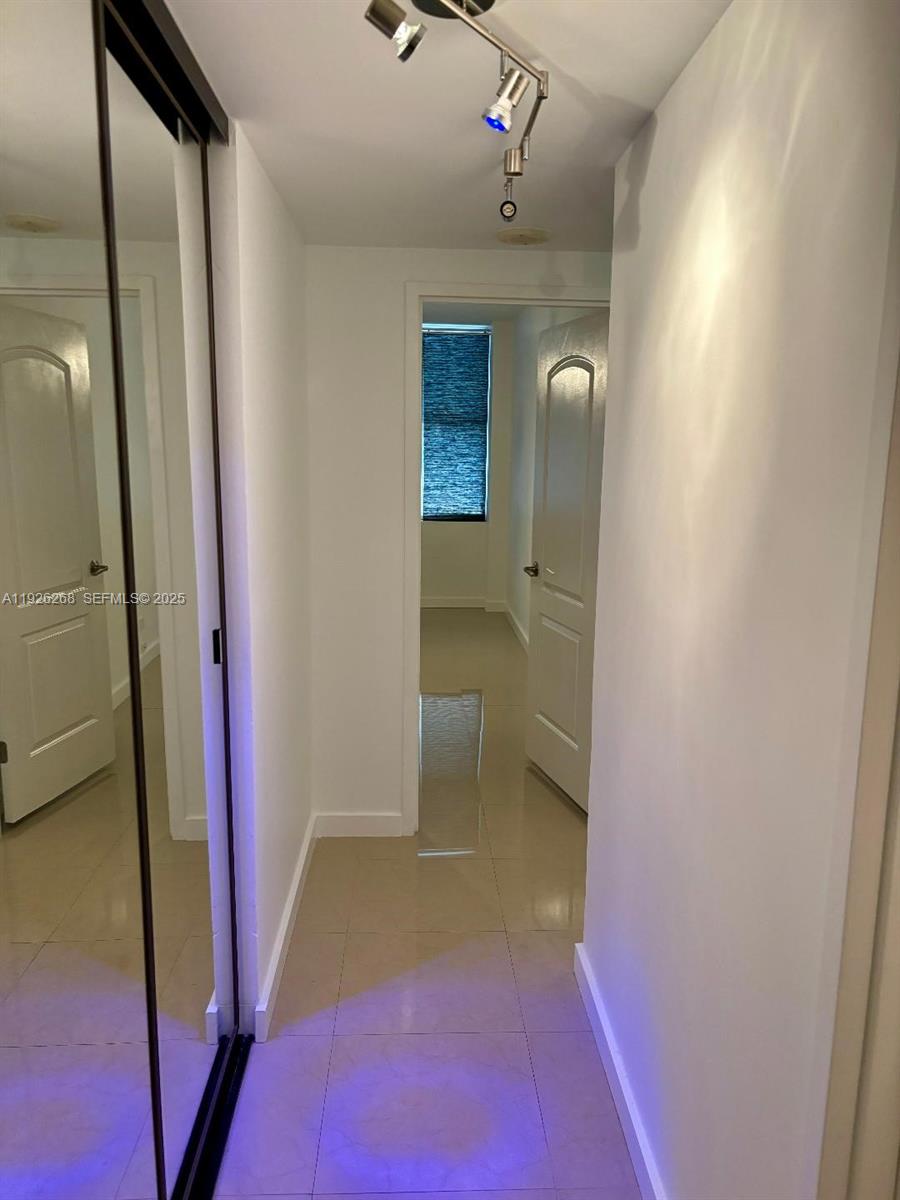 7441 Wayne Avenue, Unit 1R Miami Beach, FL 33141 - Photo 16 of 25 a bathroom with a sink and mirror