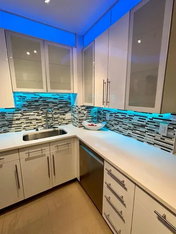 a kitchen with sink cabinets and a counter top space