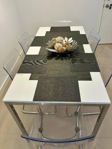 a view of a dining room with wooden floor