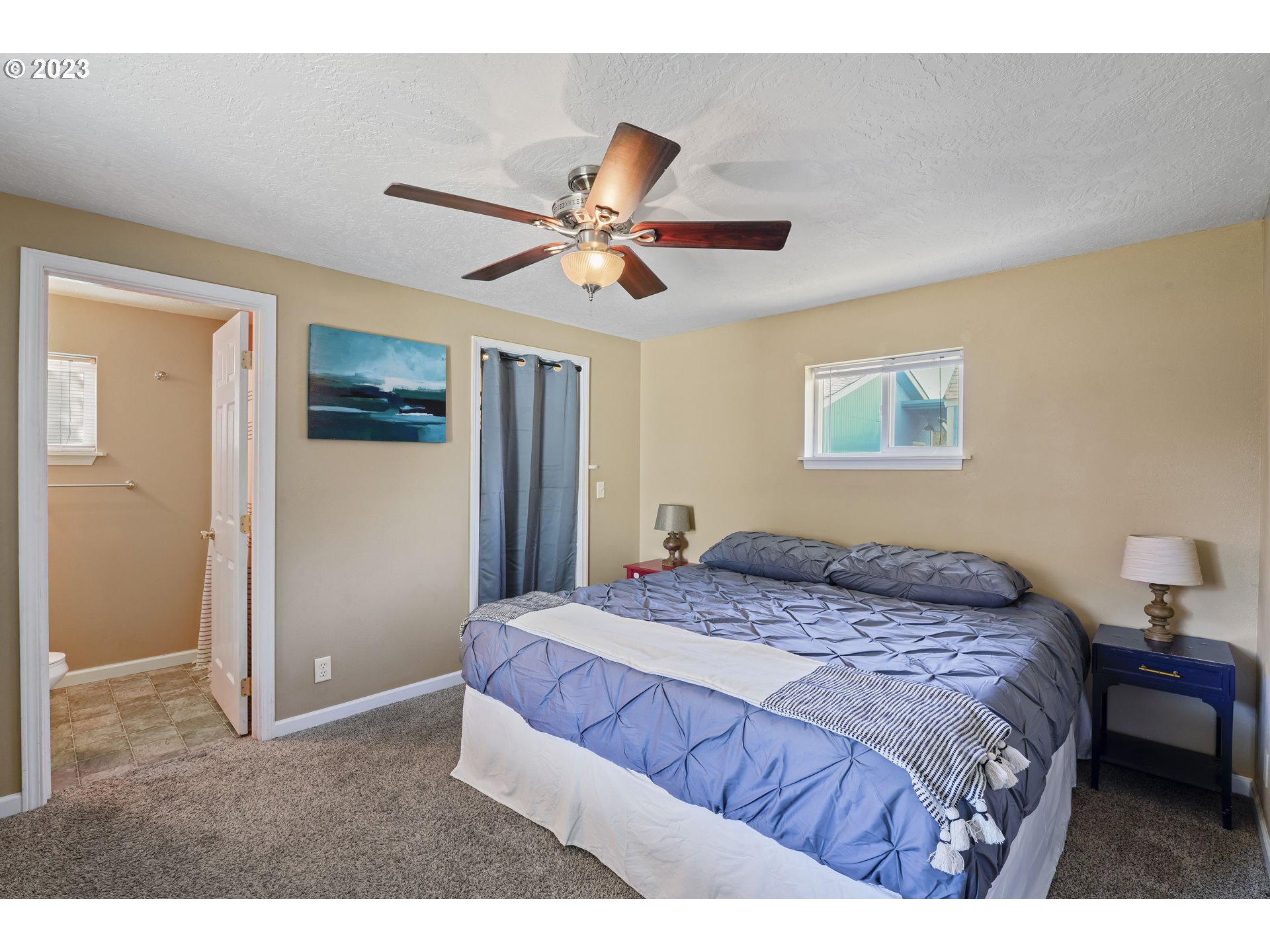 760 28th Street Springfield, OR 97477 - Photo 13 of 30 a bedroom with a bed and a chandelier