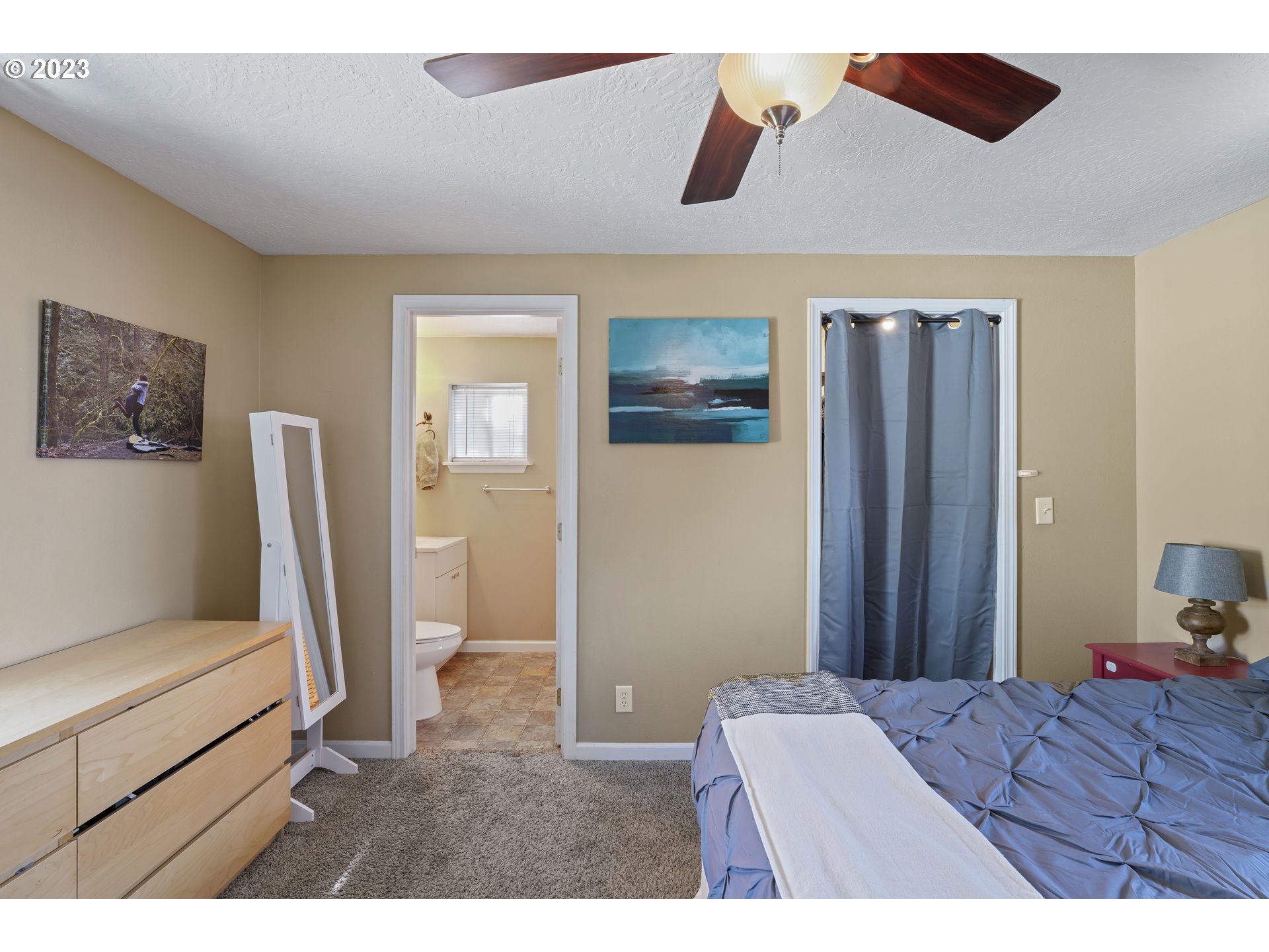 760 28th Street Springfield, OR 97477 - Photo 14 of 30 a bedroom with a bed and a flat screen tv
