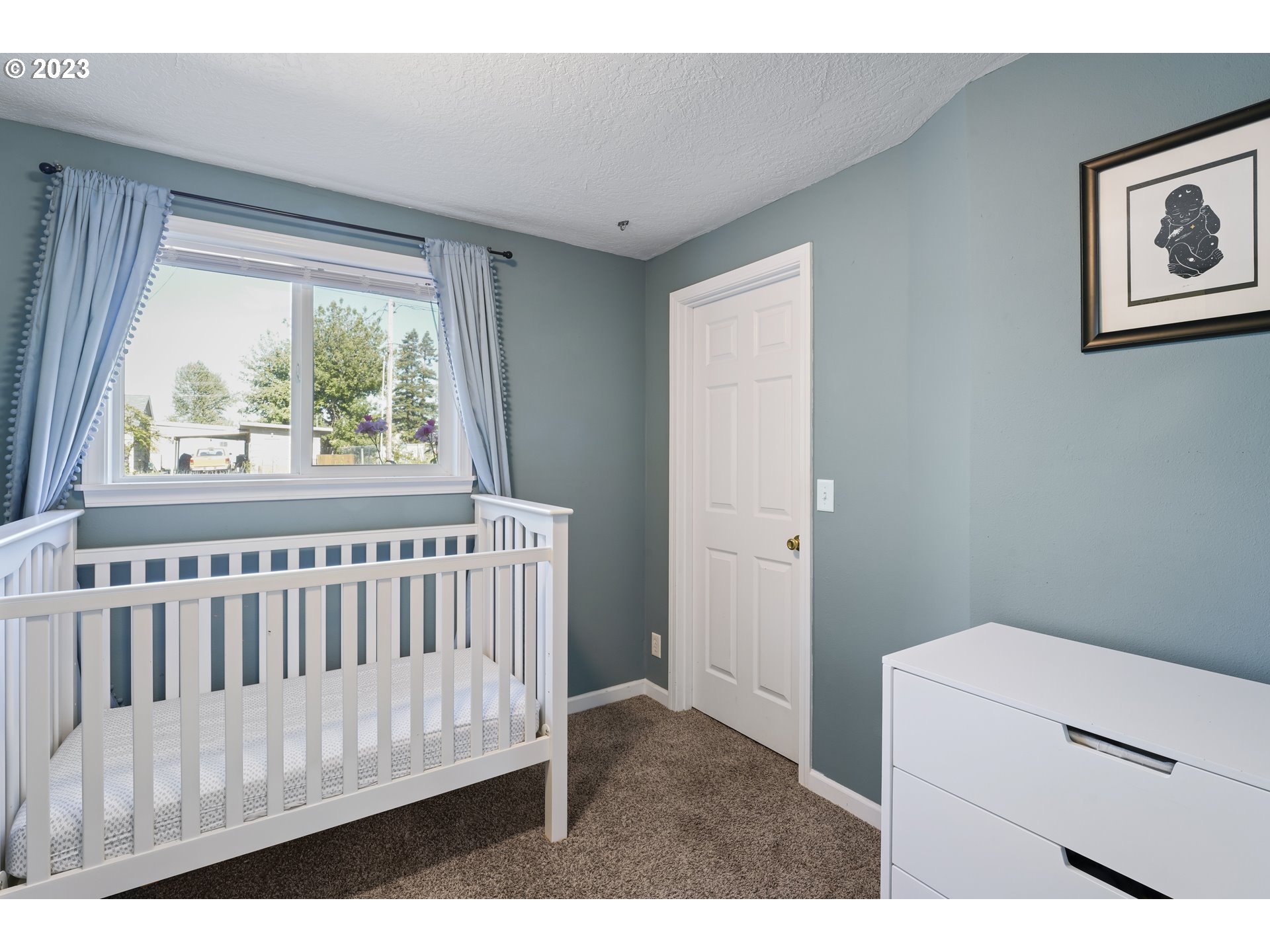 760 28th Street Springfield, OR 97477 - Photo 21 of 30 a bedroom with a bed and a window