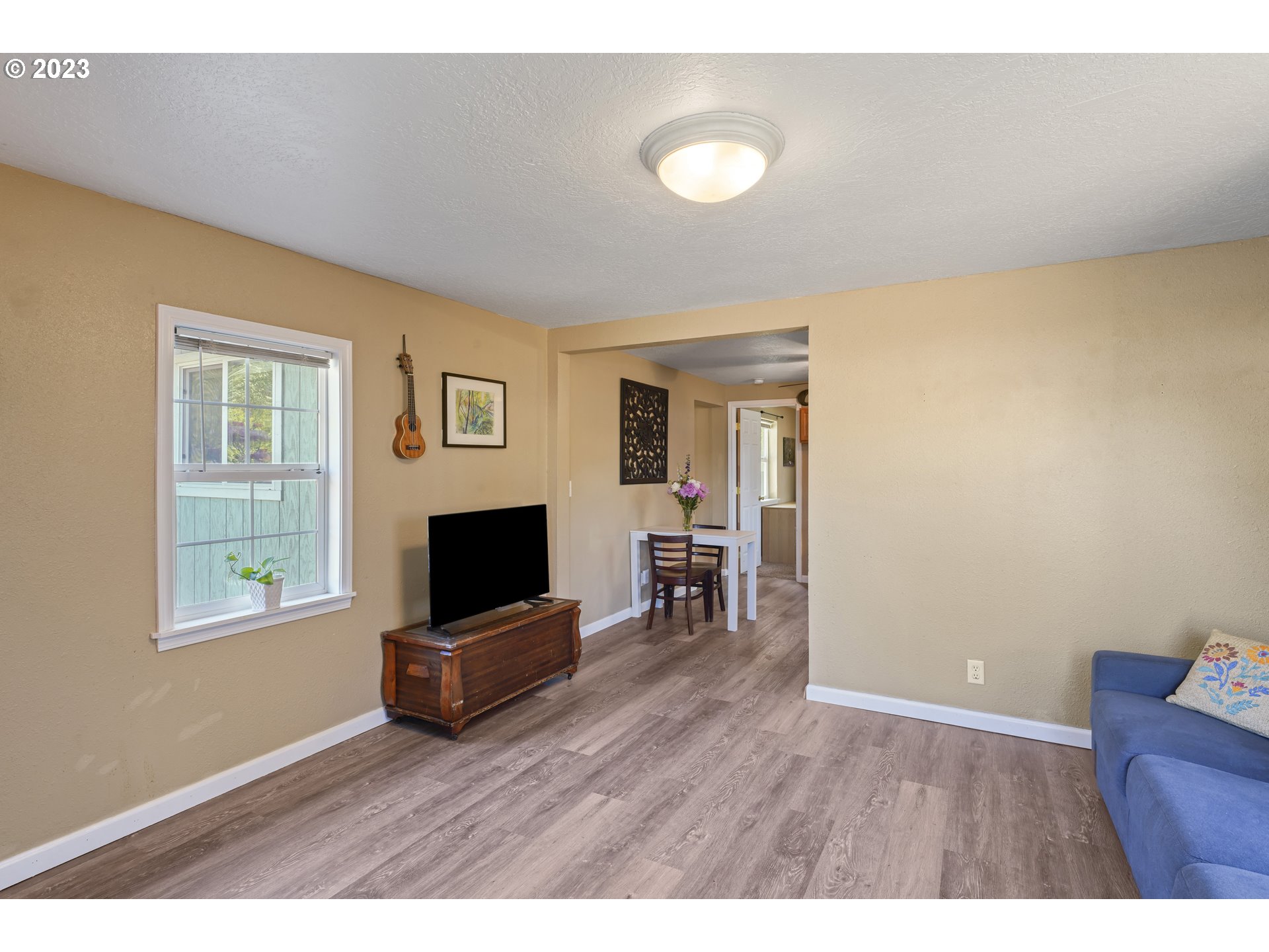 760 28th Street Springfield, OR 97477 - Photo 5 of 30 a living room with furniture and a flat screen tv