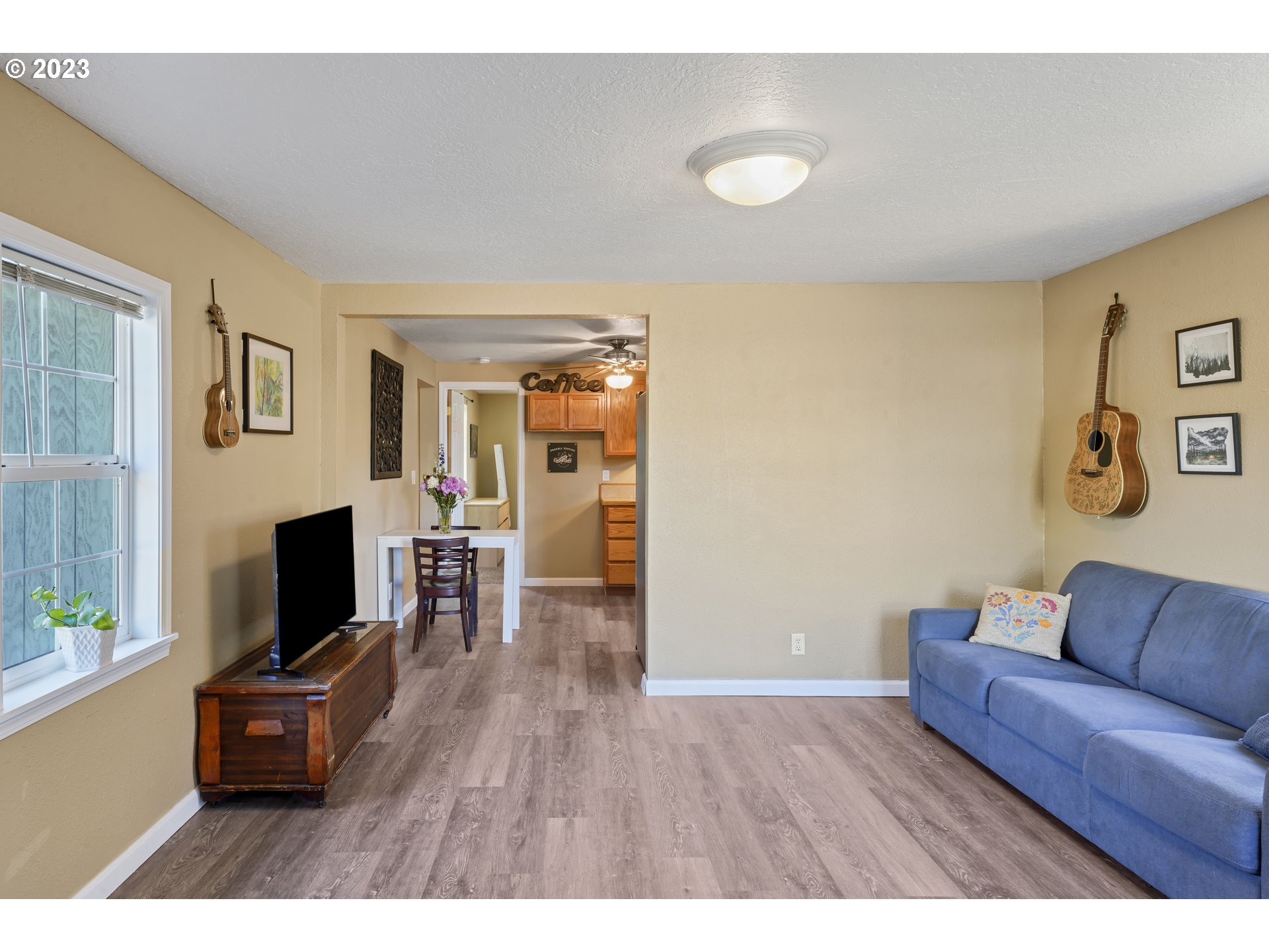 760 28th Street Springfield, OR 97477 - Photo 7 of 30 a living room with furniture and a flat screen tv