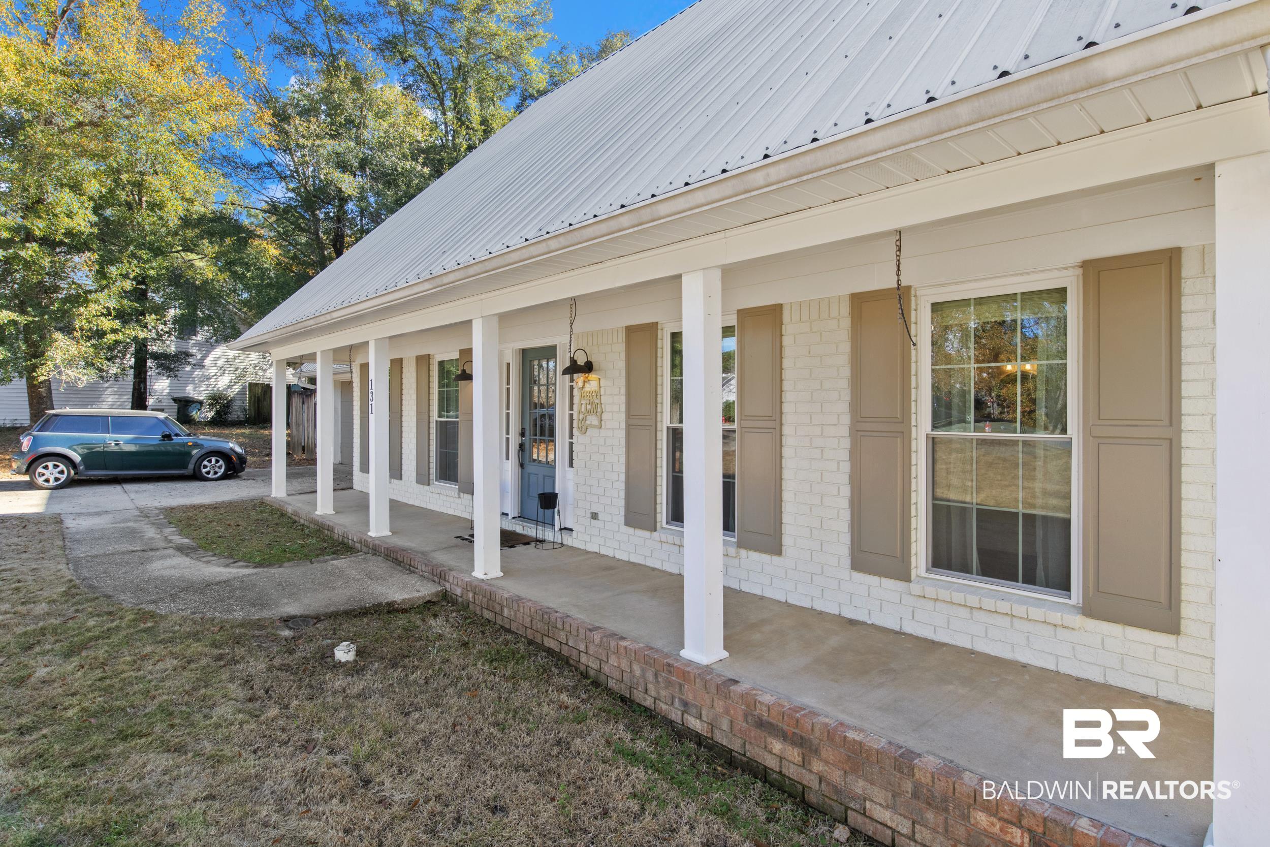 131 Marikesh Drive Daphne, AL 36526 - Photo 3 of 29 View of side of home with covered porch