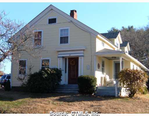 32 Mungertown Road Madison, CT 06443 - Photo 1 of 1 a front view of a house with garden