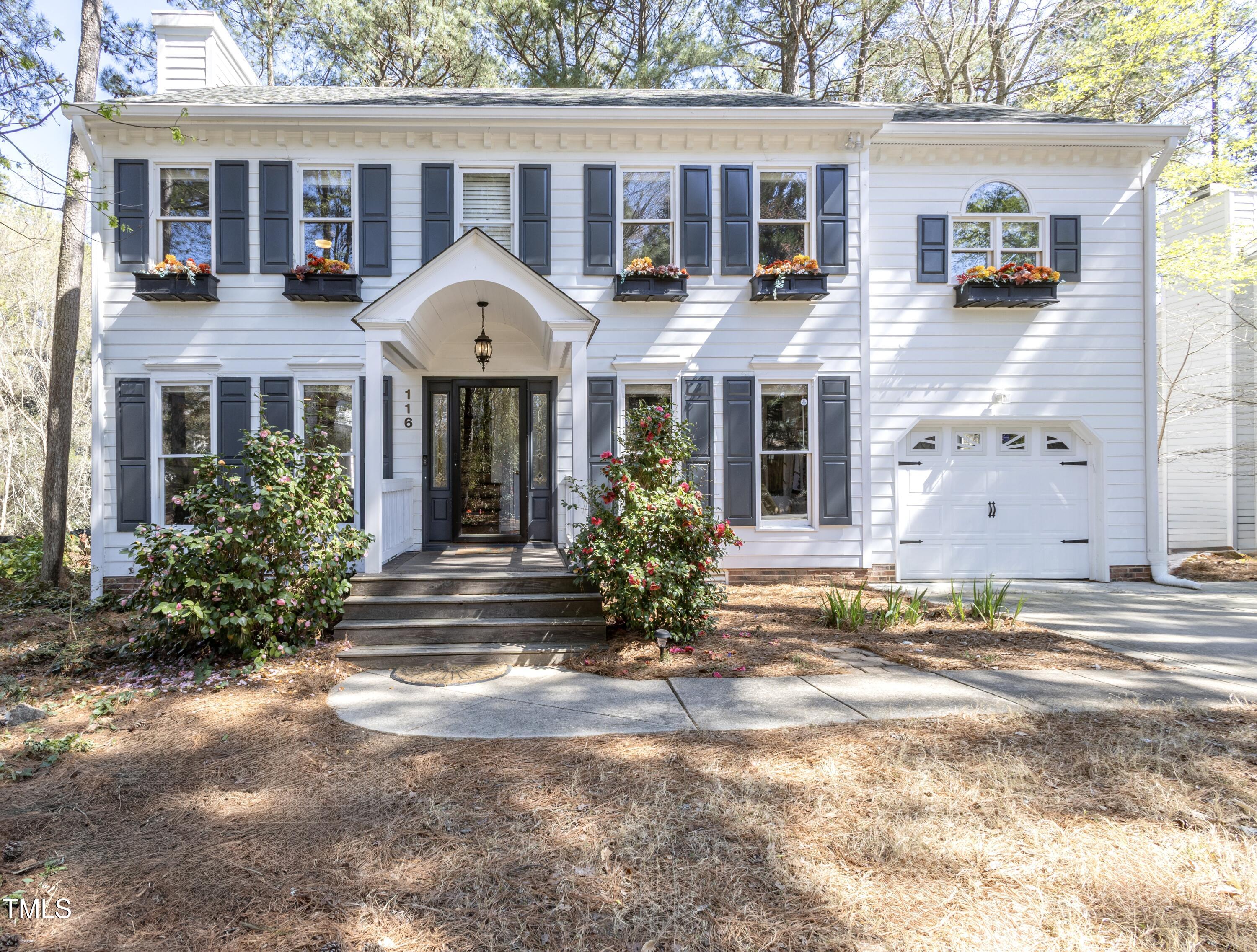 116 Lakeshore Drive Durham, NC 27713 - Photo 1 of 36 a front view of a house with garden