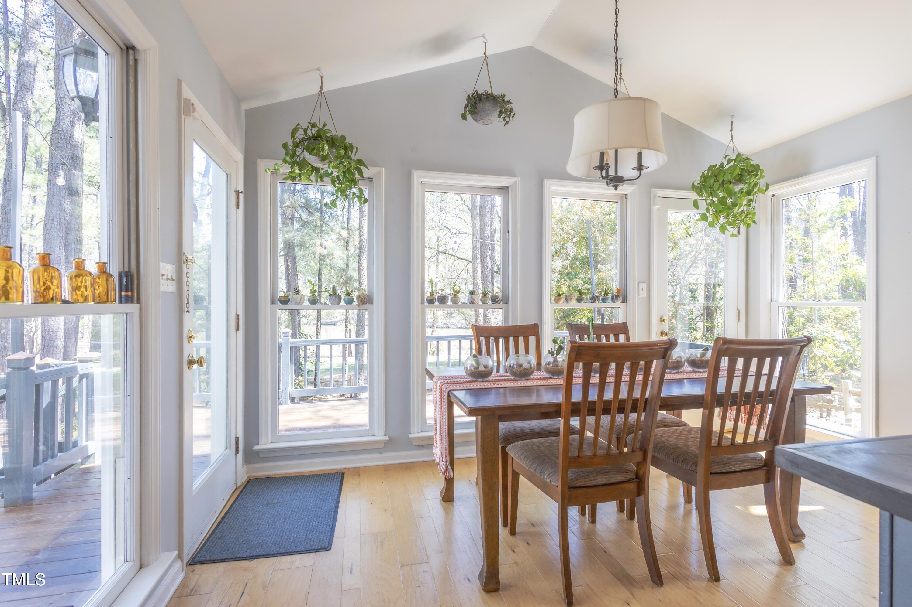 116 Lakeshore Drive Durham, NC 27713 - Photo 11 of 36 a view of a dining room with furniture window and wooden floor