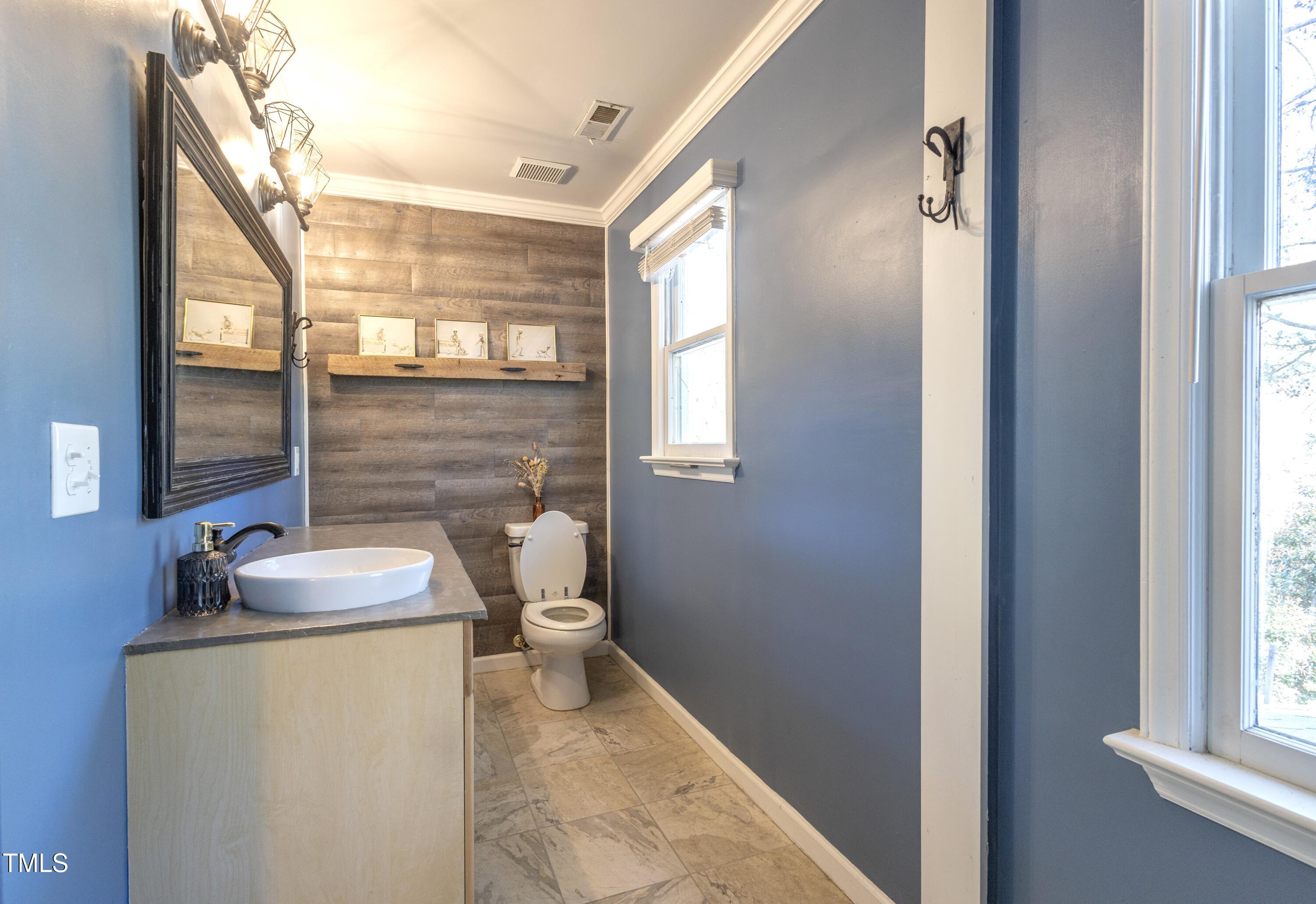 116 Lakeshore Drive Durham, NC 27713 - Photo 18 of 36 a bathroom with sink and mirror