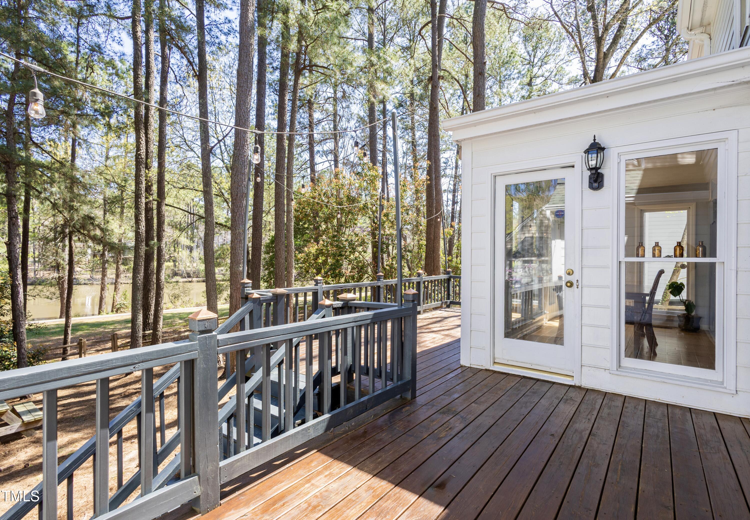 116 Lakeshore Drive Durham, NC 27713 - Photo 24 of 36 a view of a balcony with wooden floor and fence