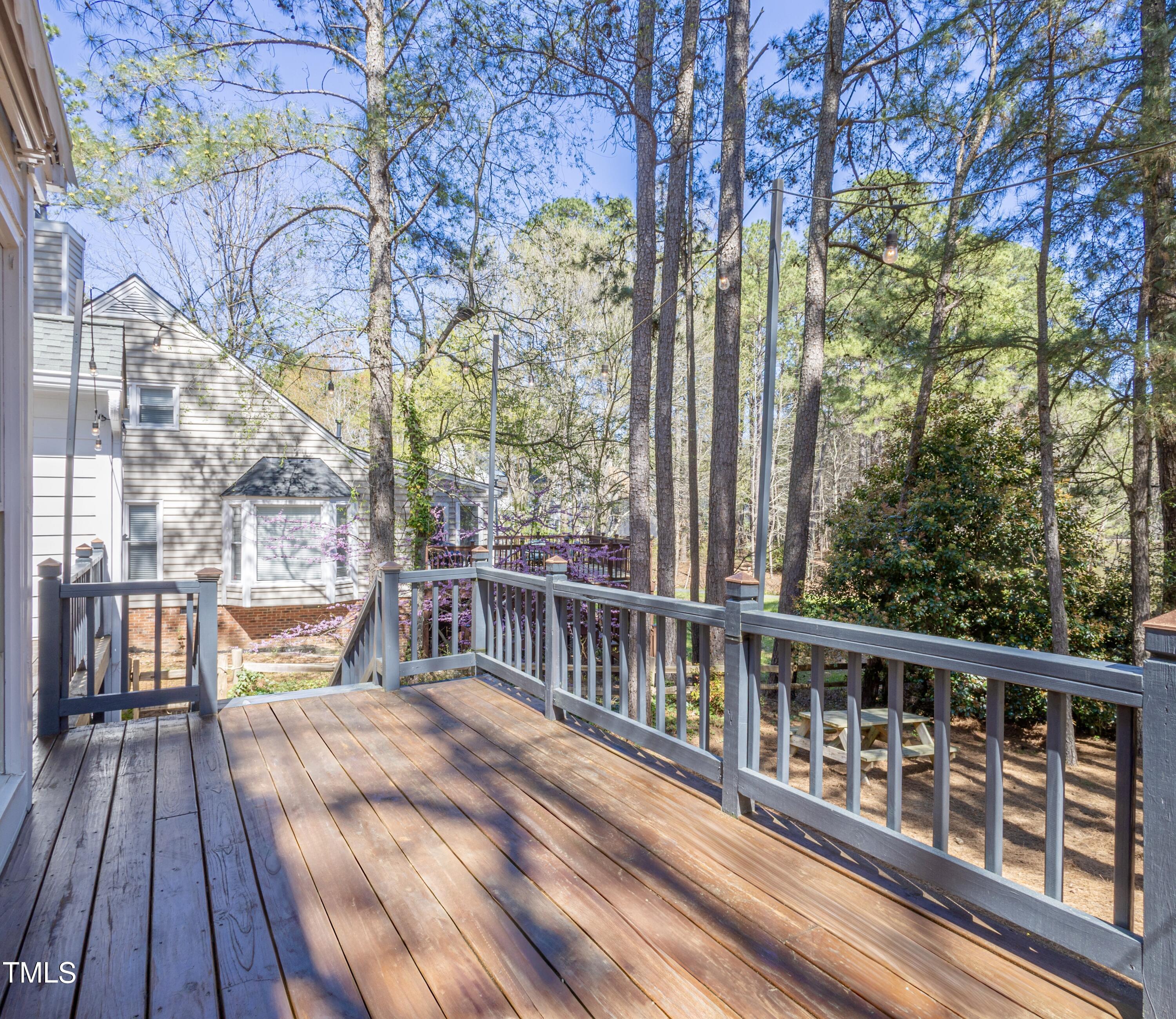 116 Lakeshore Drive Durham, NC 27713 - Photo 26 of 36 a view of a balcony with wooden floor and fence