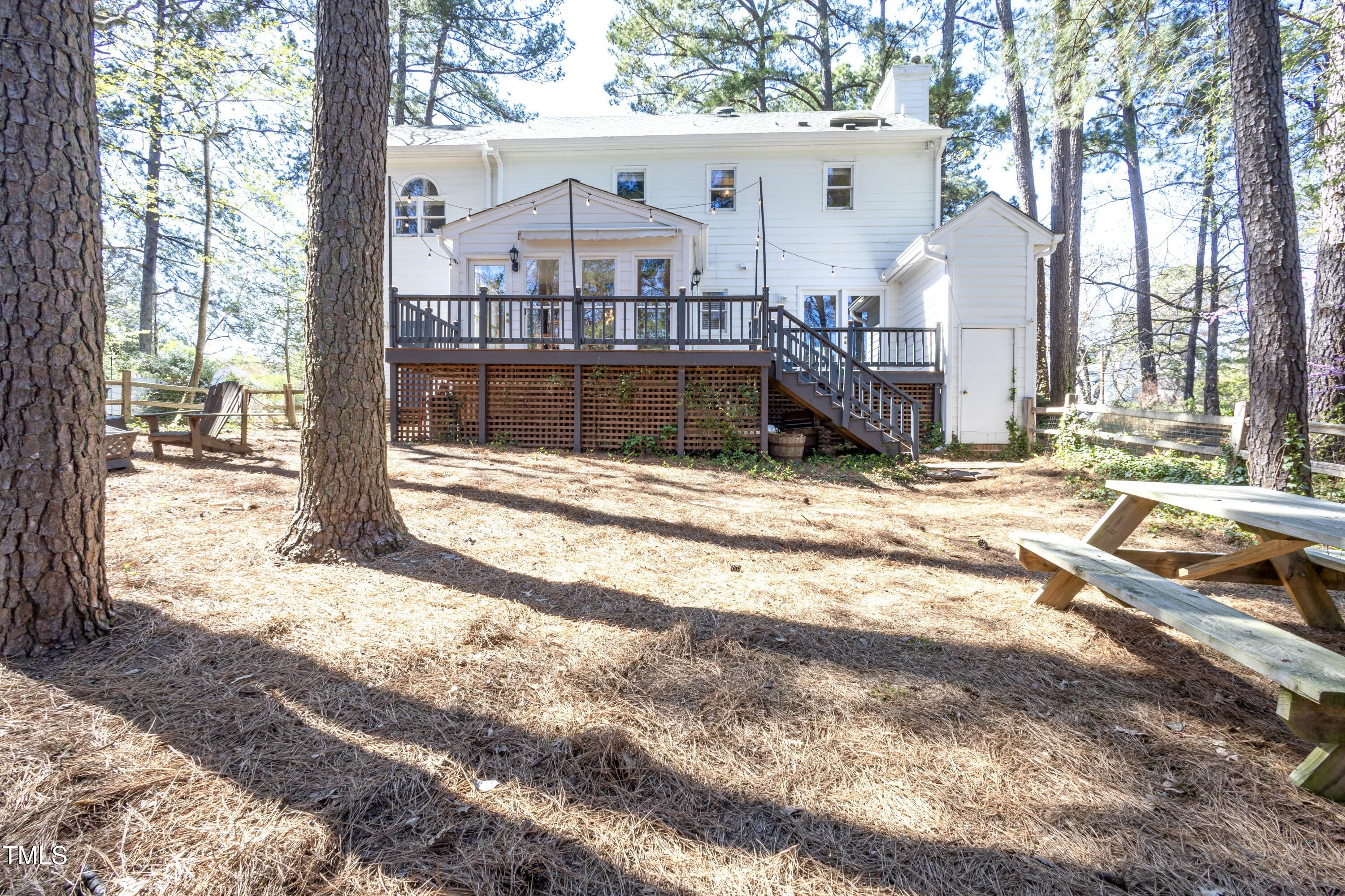 116 Lakeshore Drive Durham, NC 27713 - Photo 27 of 36 a view of a house with a yard covered in snow