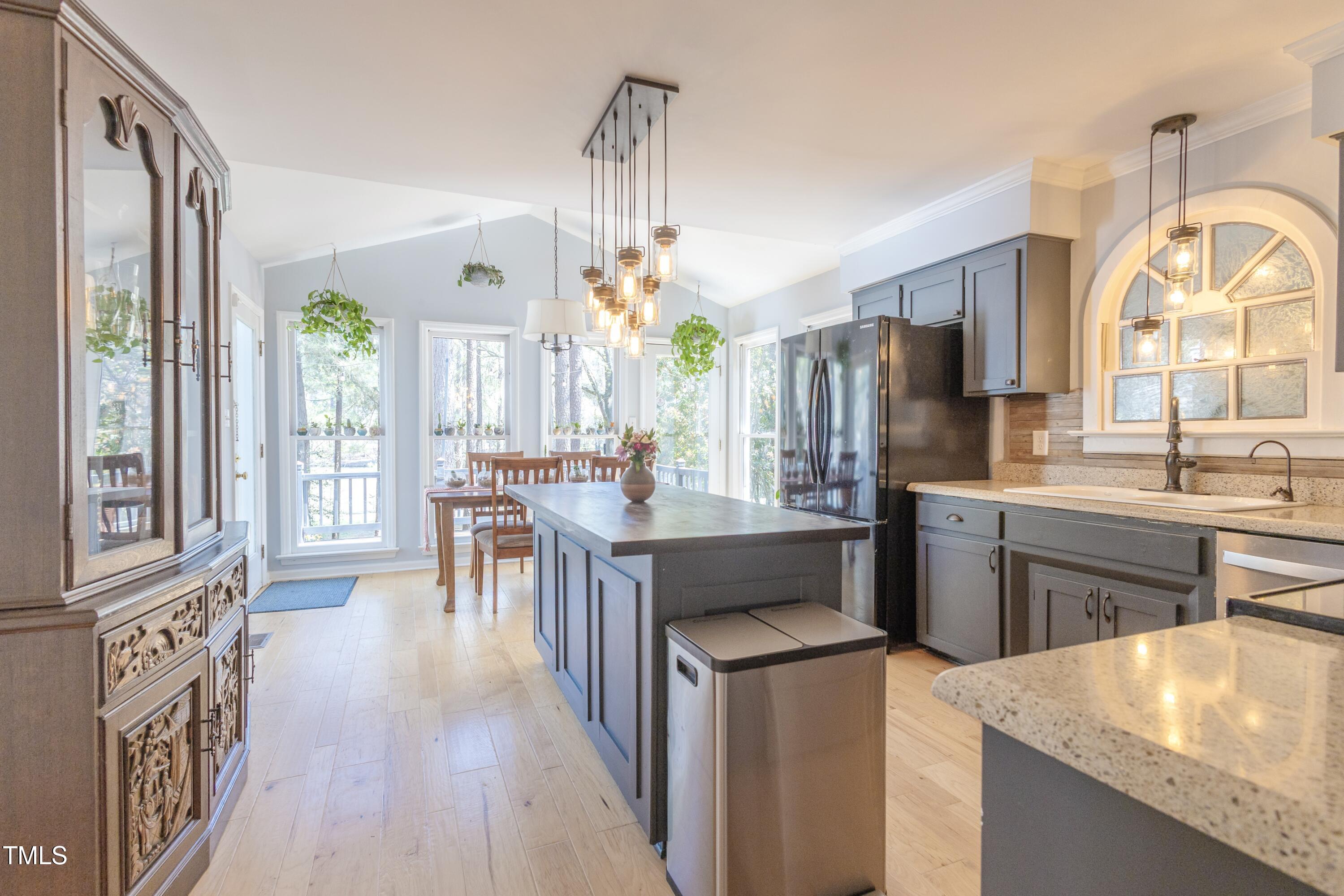 116 Lakeshore Drive Durham, NC 27713 - Photo 7 of 36 a kitchen with counter top space and wooden floor