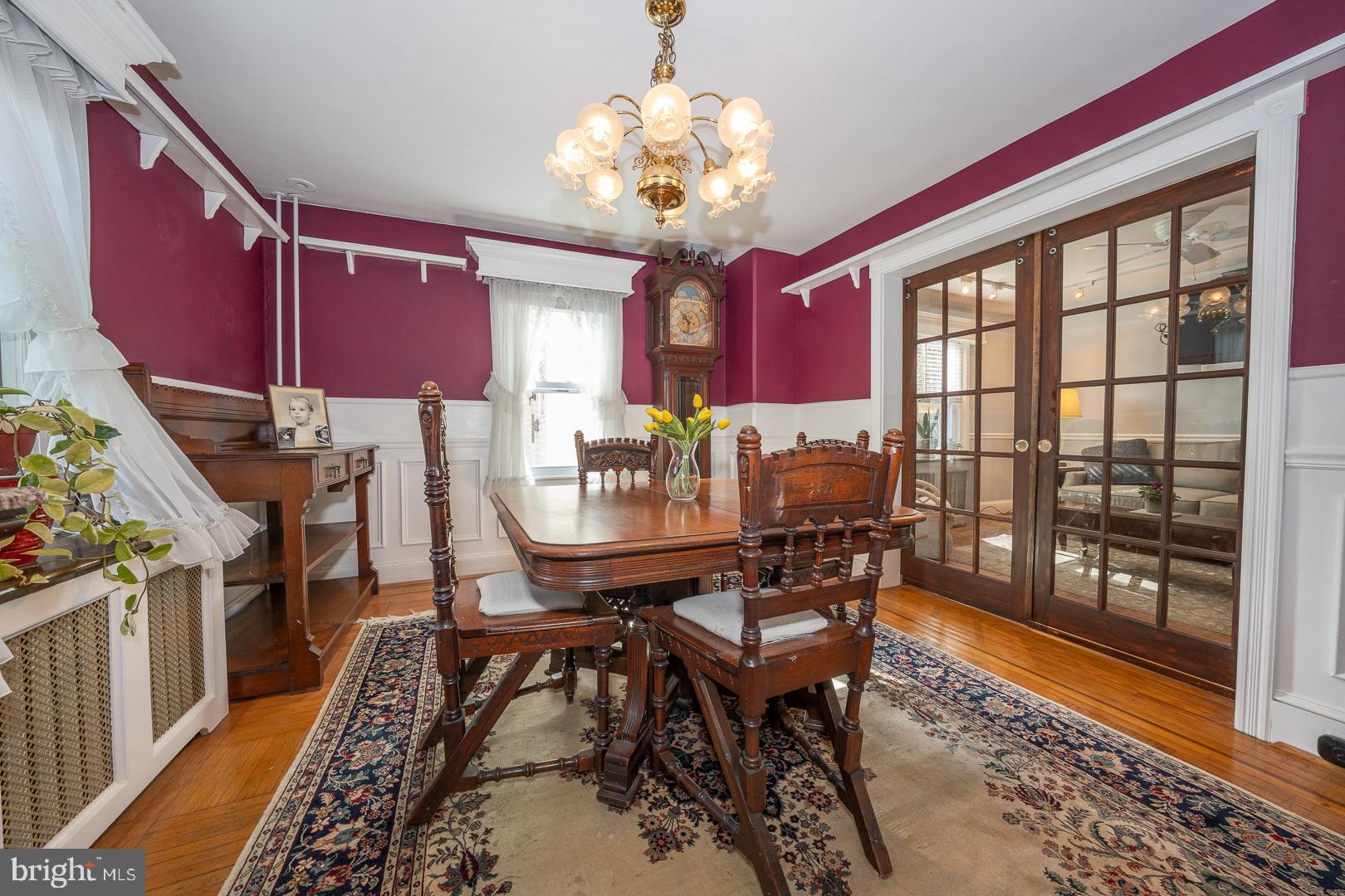255 Willow Avenue Wayne, PA 19087 - Photo 12 of 46 a view of a dining room with furniture a chandelier and wooden floor