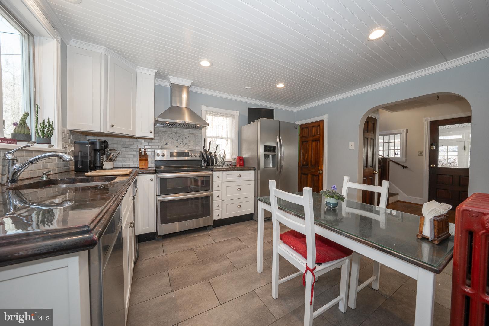 255 Willow Avenue Wayne, PA 19087 - Photo 17 of 46 a kitchen with stainless steel appliances granite countertop a sink counter space and cabinets