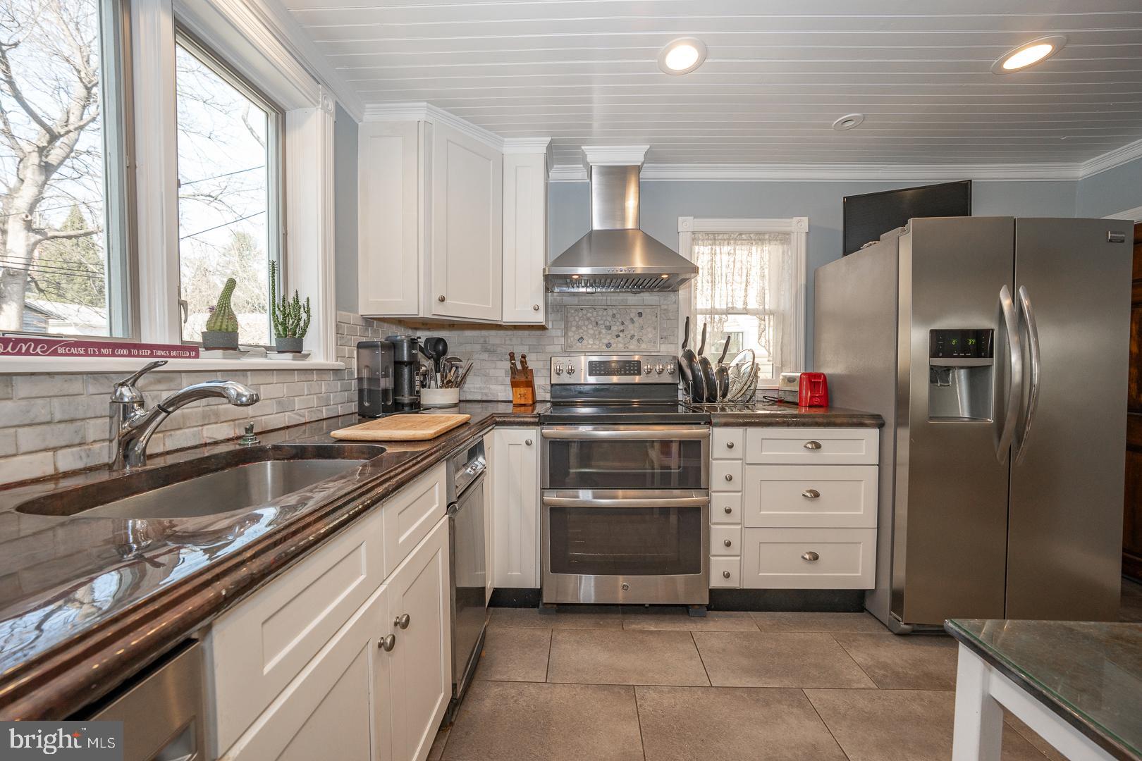 255 Willow Avenue Wayne, PA 19087 - Photo 18 of 46 a kitchen with a sink stove and refrigerator