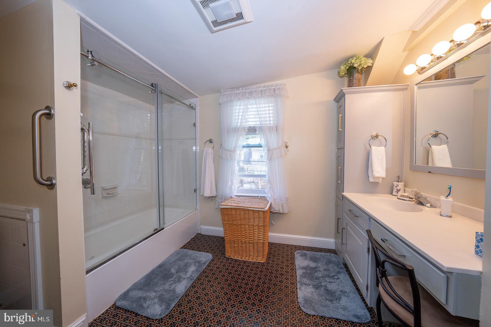 255 Willow Avenue Wayne, PA 19087 - Photo 28 of 46 a bathroom with a sink a toilet a mirror and shower
