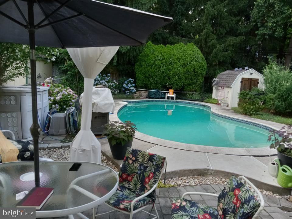 255 Willow Avenue Wayne, PA 19087 - Photo 38 of 46 a view of a swimming pool with a patio