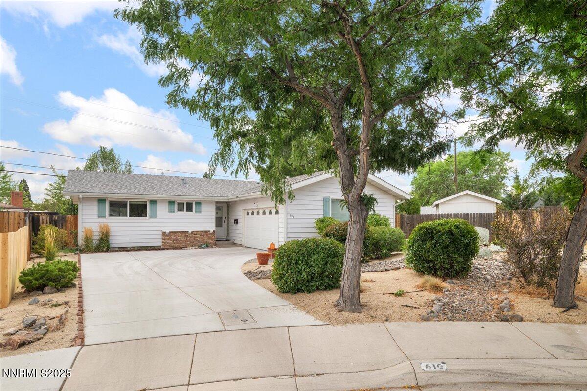 610 Akard Circle Reno, NV 89503 - Photo 1 of 28 a white house that has a tree in front of it