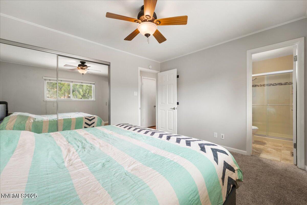 610 Akard Circle Reno, NV 89503 - Photo 13 of 28 a bedroom with a bed and a walk in closet