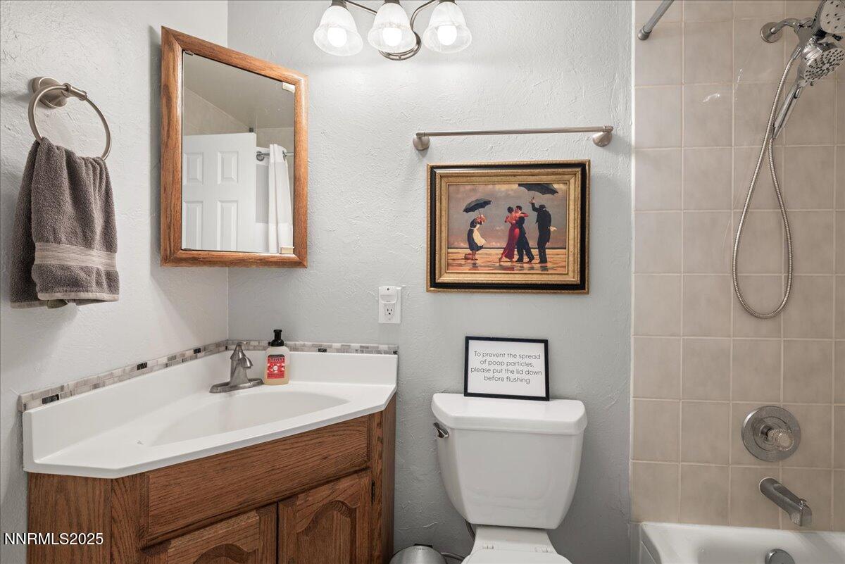 610 Akard Circle Reno, NV 89503 - Photo 17 of 28 a bathroom with a sink mirror and toilet