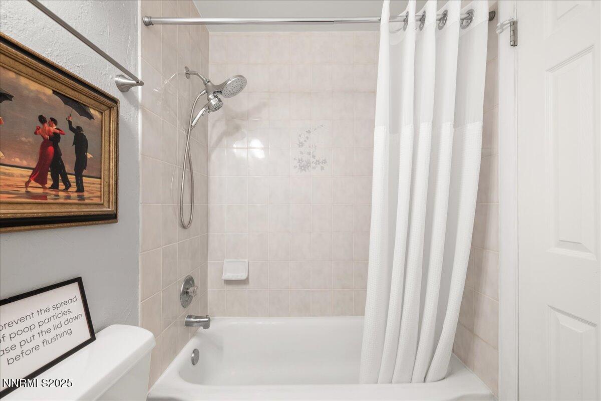 610 Akard Circle Reno, NV 89503 - Photo 18 of 28 a bathroom with a tub shower and sink