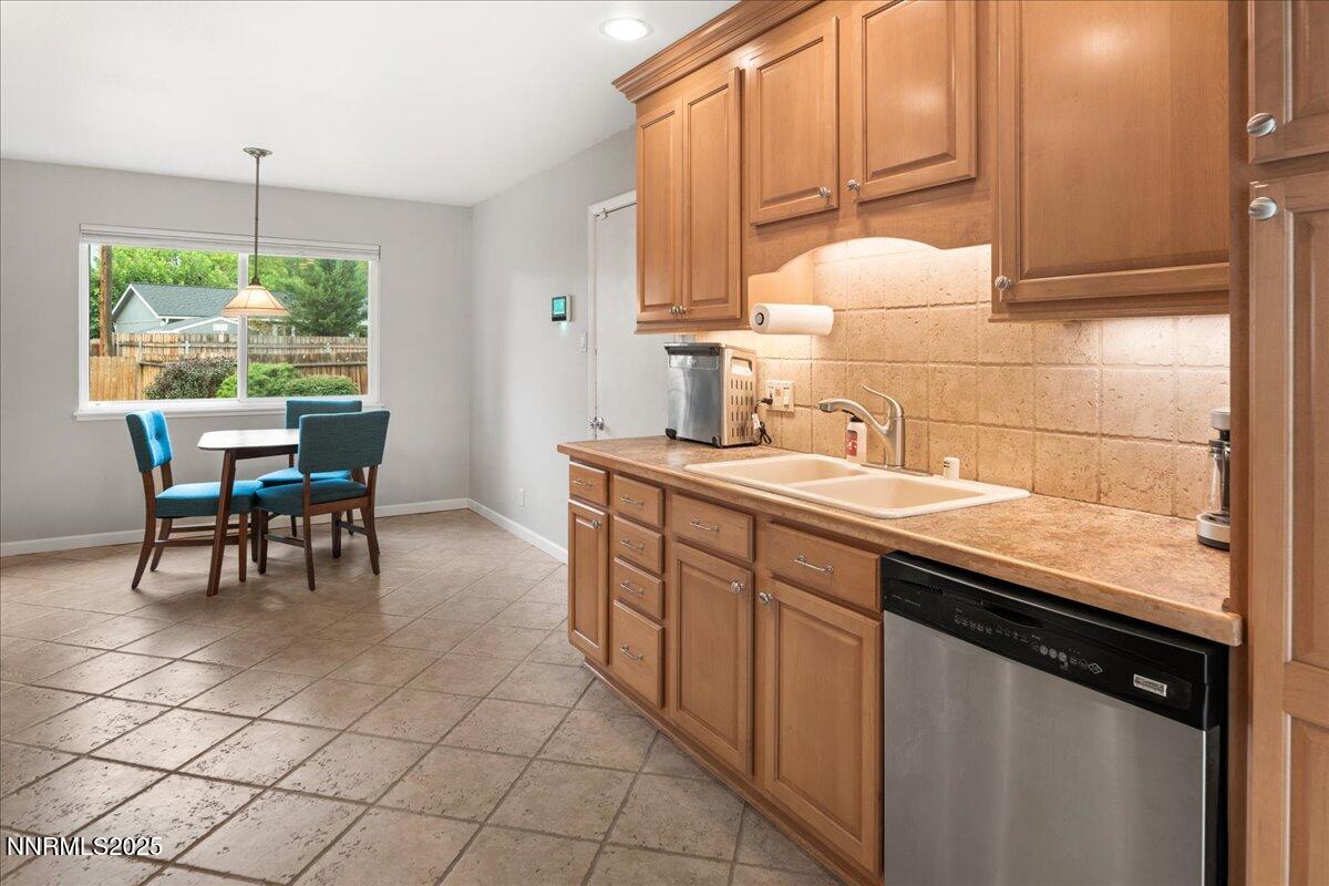 610 Akard Circle Reno, NV 89503 - Photo 6 of 28 a kitchen with stainless steel appliances granite countertop a sink and a white cabinets