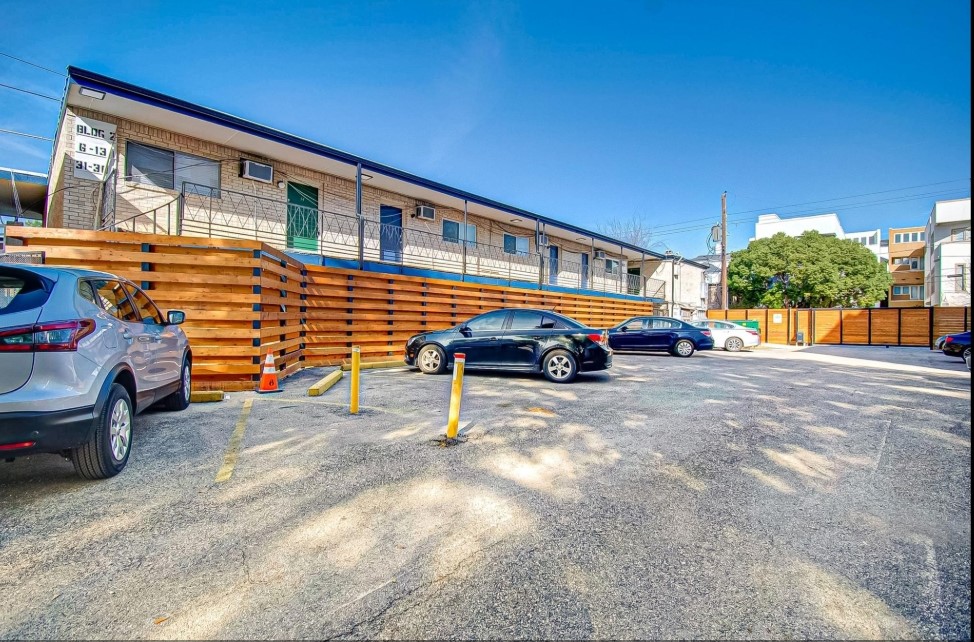 1903 Commonwealth Street, Unit 31 Houston, TX 77006 - Photo 4 of 6 a car parked in front of a house