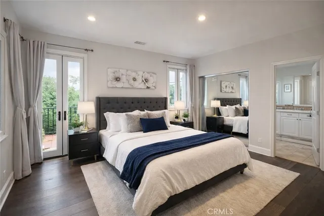 a bed room with a bed and a large window