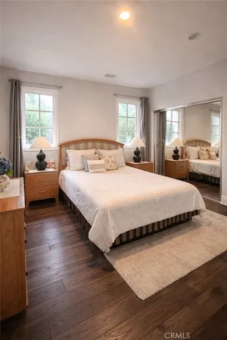 a bedroom with bed and window