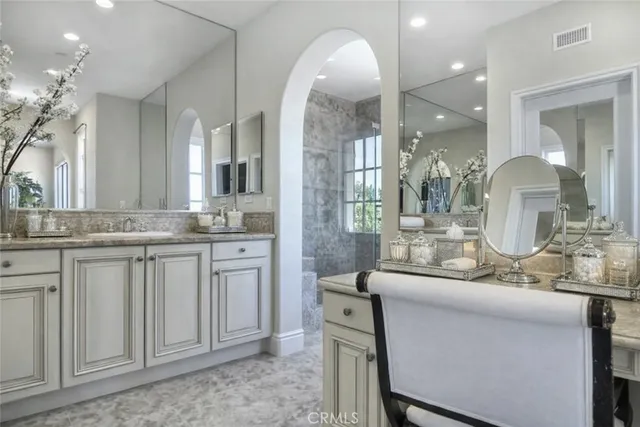 a bathroom with sink and mirror