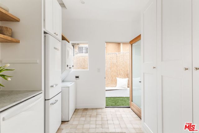 a bathroom with a tub shower and a sink