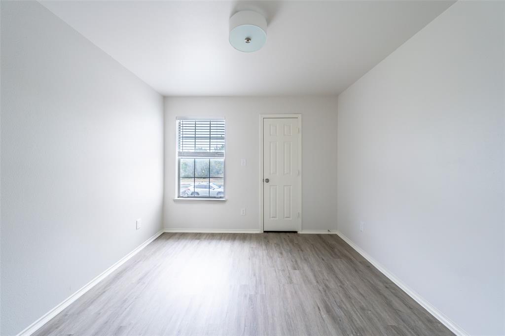 9927 Bilbrook Place, Unit B Austin, TX 78748 - Photo 10 of 13 Spare room featuring light wood finished floors and baseboards