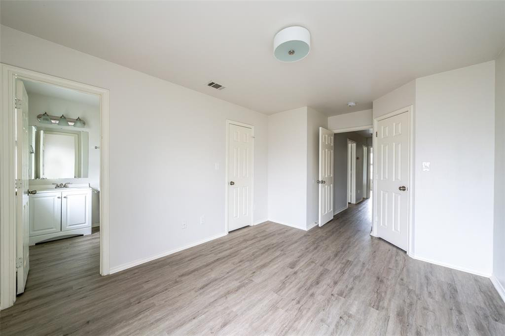 9927 Bilbrook Place, Unit B Austin, TX 78748 - Photo 5 of 13 Unfurnished bedroom with light wood-style flooring and ensuite bathroom
