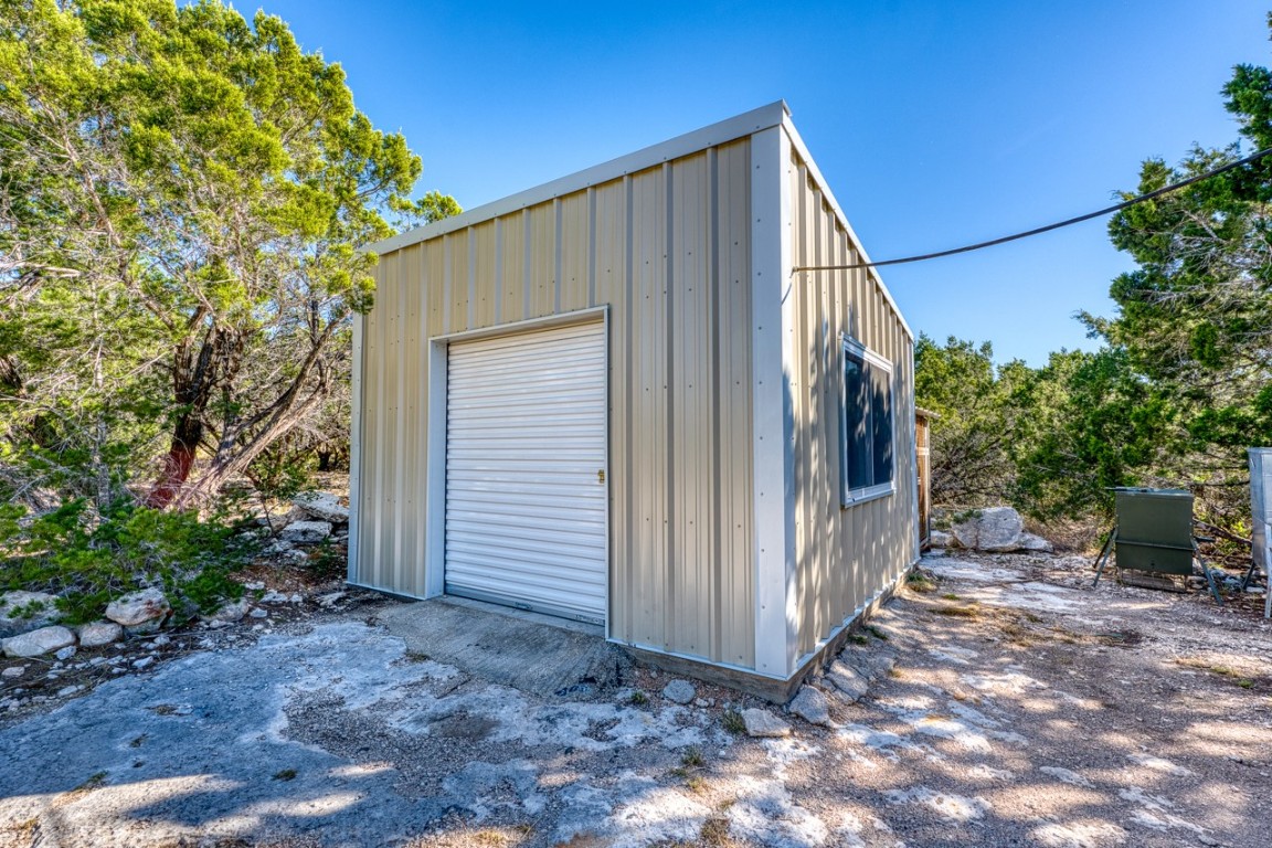 509 Pinon Loop East Camp Wood, TX 78833 - Photo 14 of 24 a view of a house with backyard and sitting area
