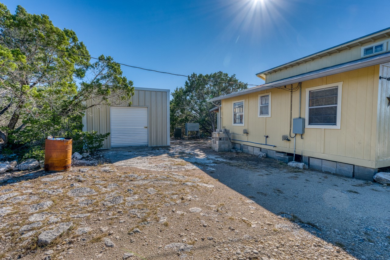 509 Pinon Loop East Camp Wood, TX 78833 - Photo 15 of 24 a view of a house with backyard
