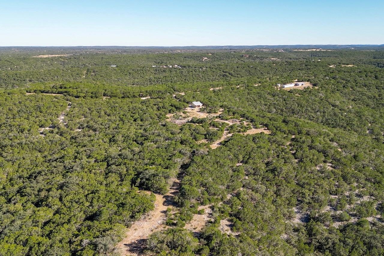 509 Pinon Loop East Camp Wood, TX 78833 - Photo 19 of 24 an aerial view of residential houses with outdoor space and trees